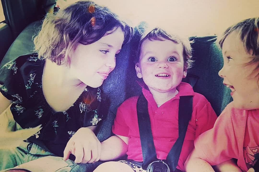 Marty as a baby with his sisters