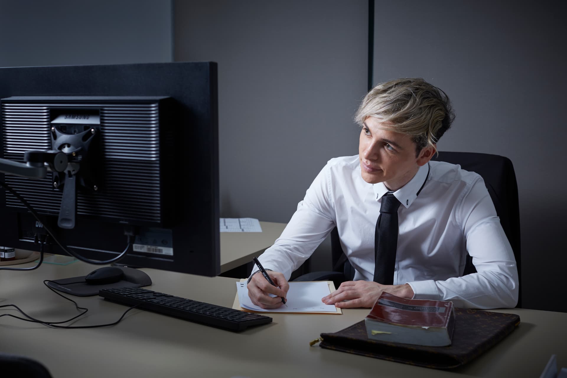 Marty reviewing estate documents at his desk