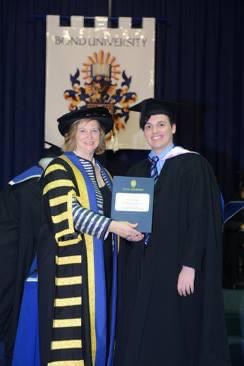Graduating on stage at Bond University